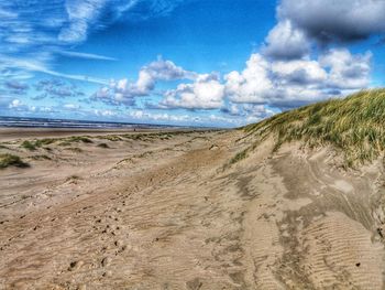 Scenic view of beach against sky