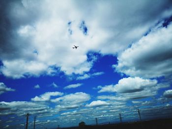 Low angle view of airplane flying in sky