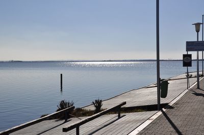 Pier over sea against sky