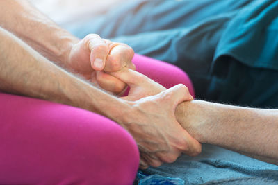 Close-up of man holding hands