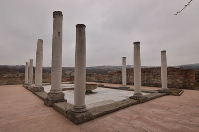 Built structure on landscape against sky