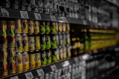 Row of bottles on display at store