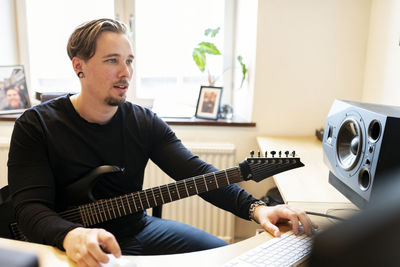 Musician working on computer