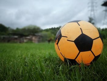 Close-up of soccer ball on field