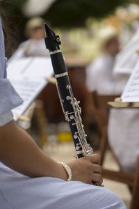 Close-up of woman playing musical instrument