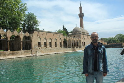 Front view of man standing in water