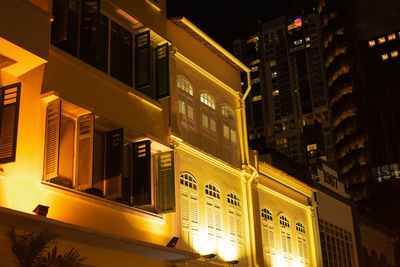 Low angle view of illuminated buildings at night