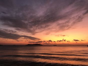 Scenic view of sea against romantic sky at sunset