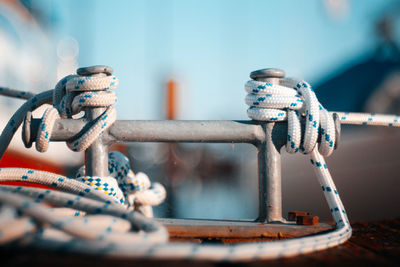 Close-up of rope tied up on metal