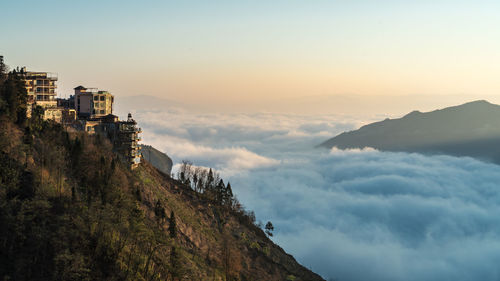 Scenic view of mountain against cloudy sky