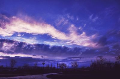 Scenic view of landscape against sky at sunset