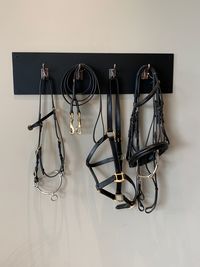 Close-up of lighting equipment on table against wall