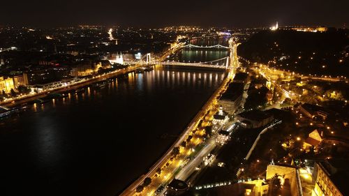 High angle view of illuminated bridge over river at night