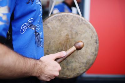 Close-up of man playing musical instrument