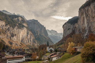 Panoramic view of mountain range against cloudy sky