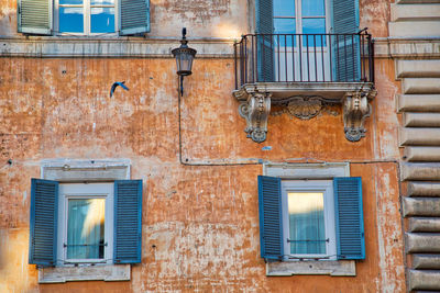 Low angle view of window on wall