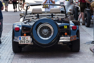 Vintage car parked on street in city