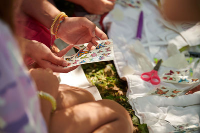 Midsection of woman holding bouquet