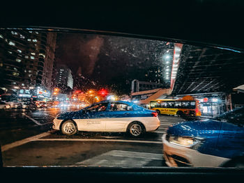 Cars on street in city at night