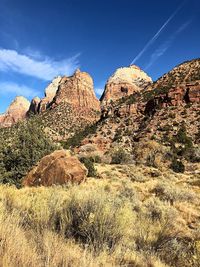 Rock formations on landscape against sky