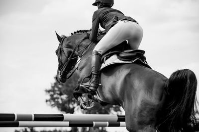 Horse jumping, equestrian sports, show jumping competition themed photograph.