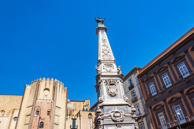 Low angle view of historic building against clear blue sky