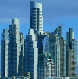 Modern buildings in city against sky