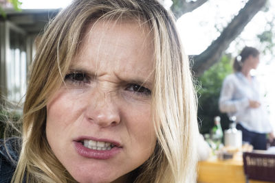 Close-up portrait of woman making face