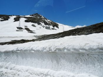 Scenic view of snowcapped mountains against sky during winter