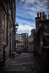 Narrow alley amidst buildings in town