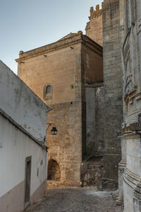 Low angle view of old ruins against clear sky. evora, medival city,  portugal