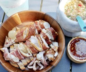 High angle view of food in plate on table.squid on the grill with seafood sauce 