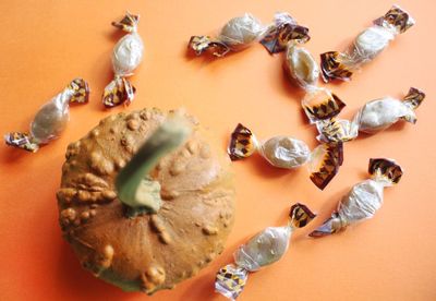 Pumpkin and candies on table, halloween