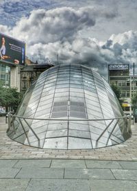 Low angle view of building against cloudy sky