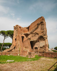 Low angle view of old ruins against sky