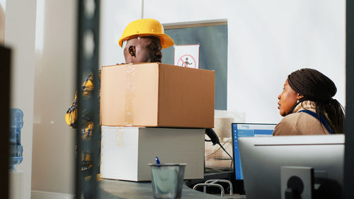 Rear view of man working in office