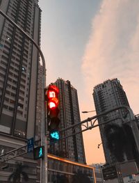 Low angle view of illuminated buildings against sky