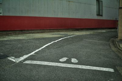 Empty road by building