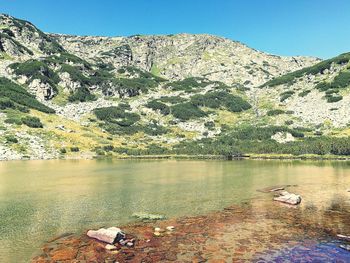 Scenic view of lake against clear sky