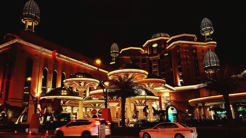 Low angle view of illuminated building at night