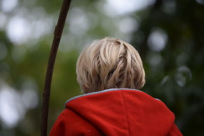 Rear view of boy wearing hooded jacket