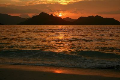 Scenic view of sea at sunset