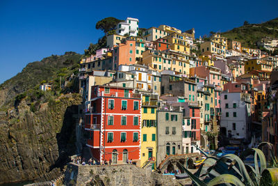 Residential buildings against clear blue sky
