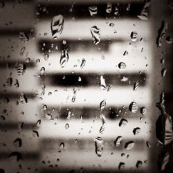 Full frame shot of wet window in rainy season