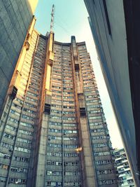 Low angle view of modern buildings against sky in city