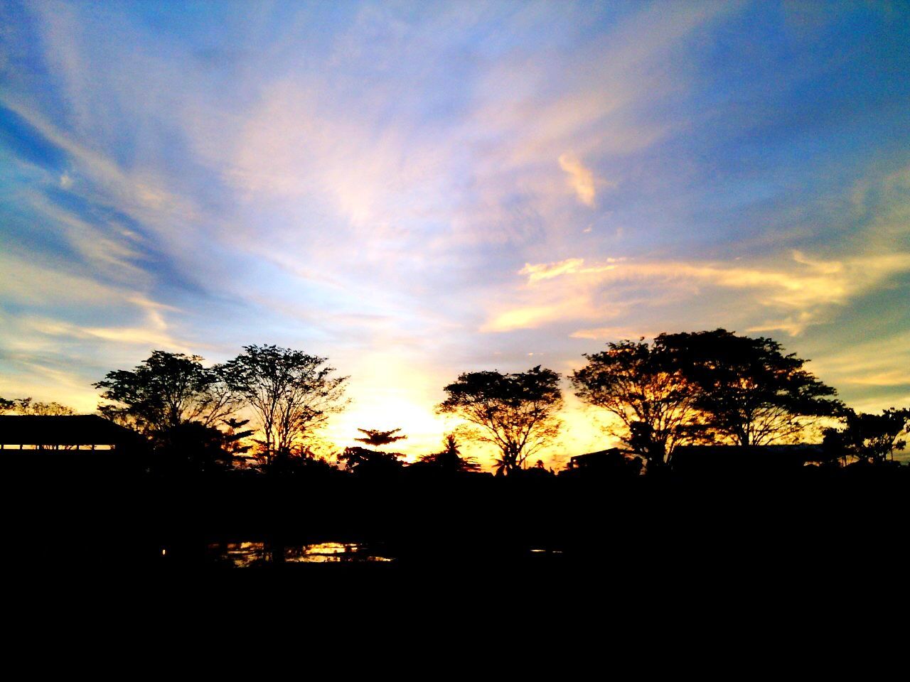 sunset, silhouette, tree, sky, scenics, tranquil scene, beauty in nature, tranquility, orange color, cloud - sky, nature, sun, idyllic, cloud, landscape, sunlight, dark, outdoors, no people, moody sky