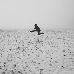 Full length of woman standing in pond