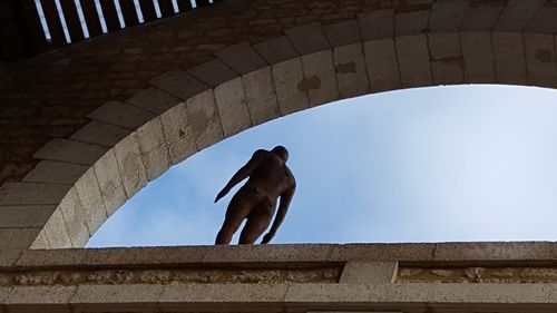 Low angle view of person walking on steps