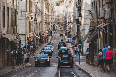 People walking on street in city