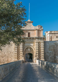 Footbridge by entrance in city